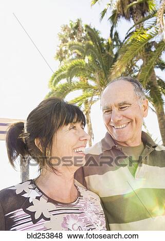 Stock Photo - Smiling senior couple outdoors. Fotosearch