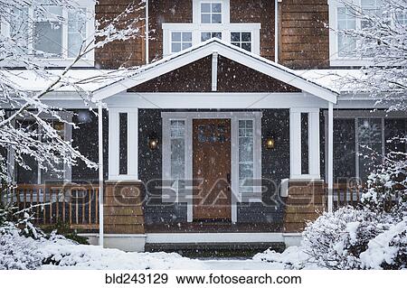 Snow falling near house View Large Photo Image Stock Photo - Snow falling near house. Fotosearch