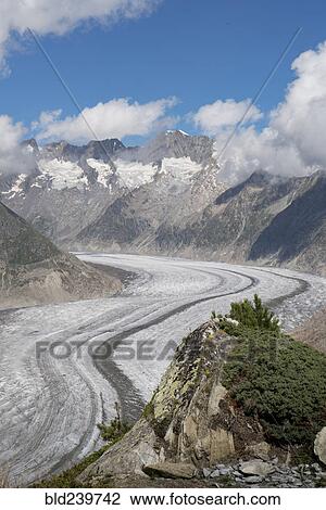 Stock Image - Snow in remote mountain landscape. Fotosearch