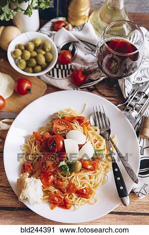 Stock Image - "Spaghetti with bread, tomatoes and wine". Fotosearch