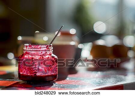 Stock Photo - Spoon in jar of jam. Fotosearch