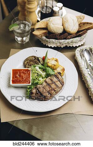 Steak dinner on plate View Large Photo Image Stock Photograph - Steak dinner on plate. Fotosearch