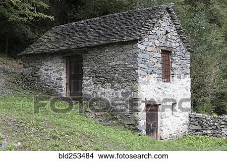 Picture - Stone house in hillside. Fotosearch