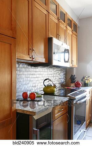 Stove and cabinets in modern kitchen View Large Photo Image Stock Photography - Stove and cabinets in modern kitchen. Fotosearch