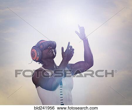 Strong man using virtual reality helmet View Large Photo Image Stock Photograph - Strong man using virtual reality helmet. Fotosearch