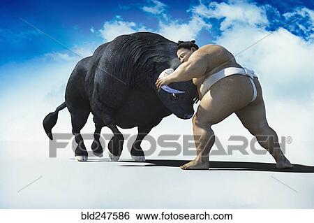 Stock Photograph - Sumo wrestler battling bull. Fotosearch