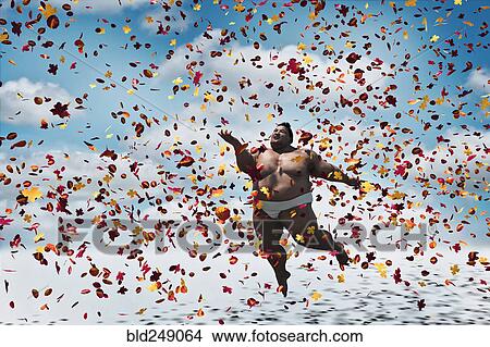 Picture - Sumo wrestler floating in autumn leaves. Fotosearch