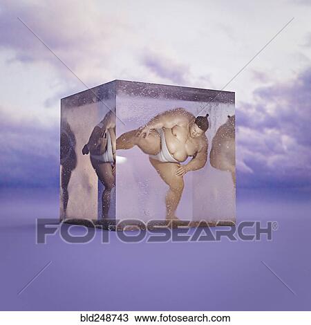 Stock Image - Sumo wrestler frozen in suspended animation. Fotosearch