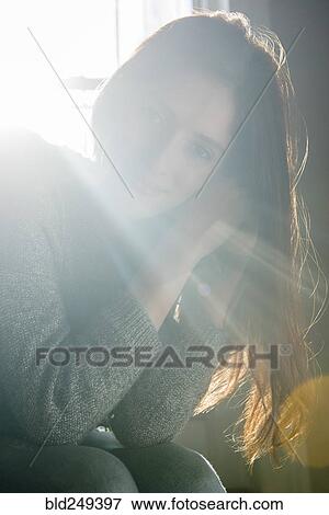 Sunbeams on smiling Caucasian woman View Large Photo Image Stock Photo - Sunbeams on smiling Caucasian woman. Fotosearch