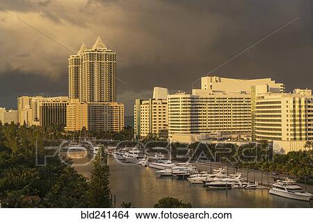 Picture - Sunset on boats at urban waterfront. Fotosearch
