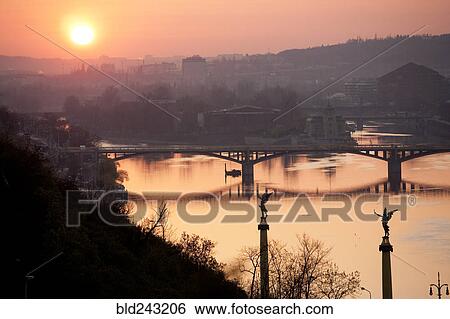 "Sunset on bridge over river, Prague, Czech Republic" View Large Photo Image Stock Photograph - "Sunset on bridge over river, Prague, Czech Republic". Fotosearch