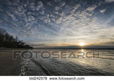 Sunset on ocean beach View Large Photo Image Stock Photo - Sunset on ocean beach. Fotosearch