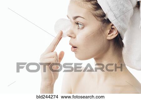 Surprised Caucasian woman cleaning skin with pad View Large Photo Image Picture - Surprised Caucasian woman cleaning skin with pad. Fotosearch