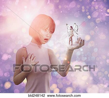 Stock Image - Surprised woman with fairy in hand. Fotosearch