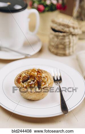 Stock Photo - Tart on plate with fork. Fotosearch