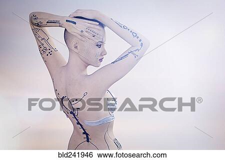 Stock Photograph - Tattoos on arms and back of futuristic woman. Fotosearch