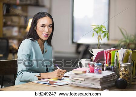 Stock Photo - Thai transgender businesswoman working in office. Fotosearch