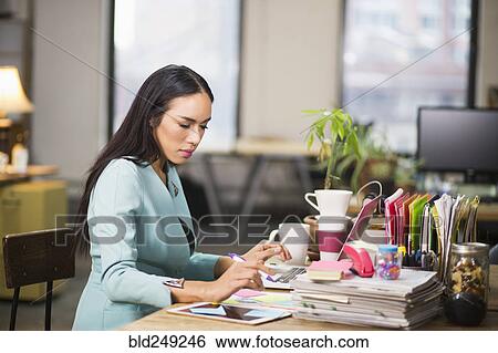 Stock Photograph - Thai transgender businesswoman working in office. Fotosearch