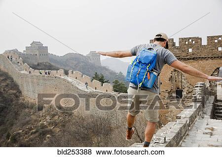Stock Photo - Tourist balancing on Great Wall of China, Beijing, China. Fotosearch