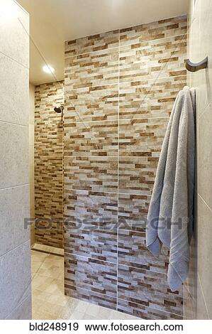 Towel hanging in luxury shower View Large Photo Image Stock Photo - Towel hanging in luxury shower. Fotosearch