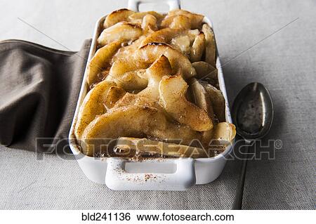 Tray of baked apples with spoon View Large Photo Image Stock Photograph - Tray of baked apples with spoon. Fotosearch