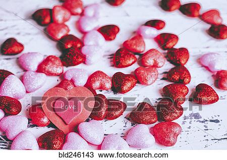 Stock Image - Valentine hearts on table. Fotosearch