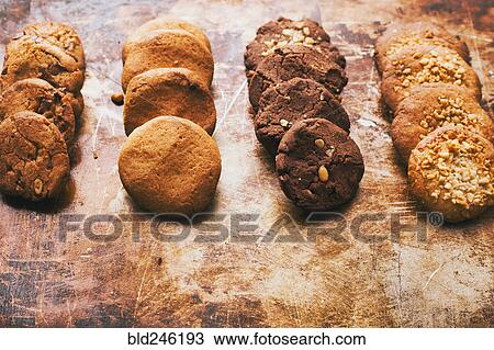 Stock Image - Variety of cookies in rows. Fotosearch
