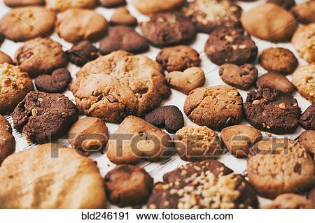 Variety of cookies on wooden table View Large Photo Image Stock Image - Variety of cookies on wooden table. Fotosearch