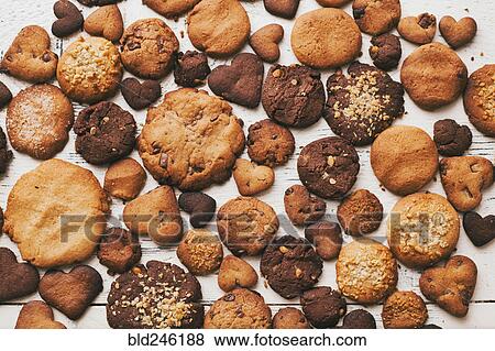 Variety of cookies on wooden table View Large Photo Image Stock Photo - Variety of cookies on wooden table. Fotosearch