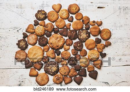 Stock Photo - Variety of cookies on wooden table. Fotosearch