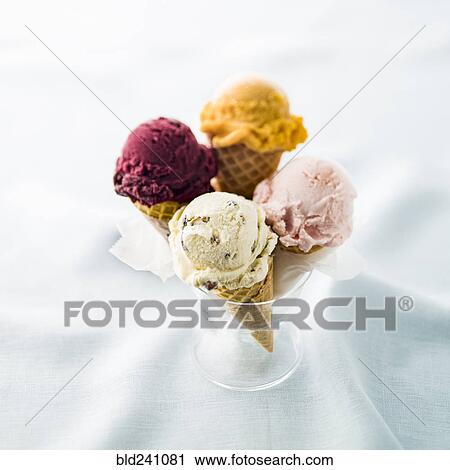 Stock Image - Variety of ice cream cones in glass. Fotosearch