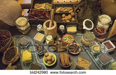 Stock Image - Variety of spice ingredients on table. Fotosearch