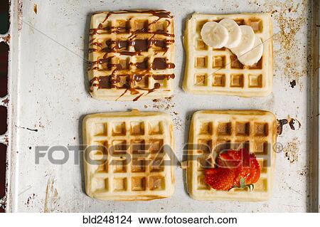 Variety of waffles on pan View Large Photo Image Picture - Variety of waffles on pan. Fotosearch
