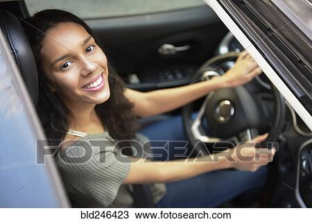 View from sunroof of Hispanic woman driving car View Large Photo Image Stock Image - View from sunroof of Hispanic woman driving car. Fotosearch