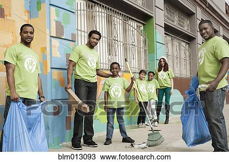 Stock Image - Volunteers picking up litter. Fotosearch