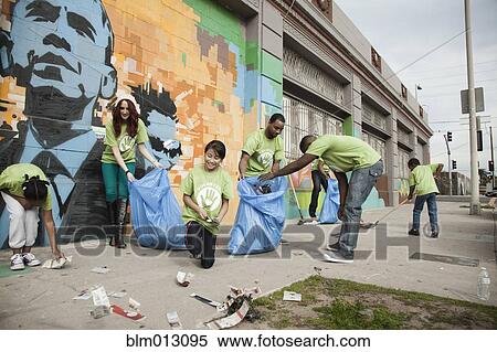 Stock Photography - Volunteers picking up litter. Fotosearch