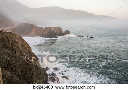 Waves splashing on rocks at cliffs View Large Photo Image Stock Image - Waves splashing on rocks at cliffs. Fotosearch