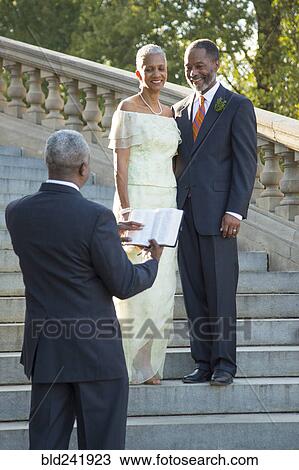 Stock Image - Wedding ceremony on stone staircase. Fotosearch