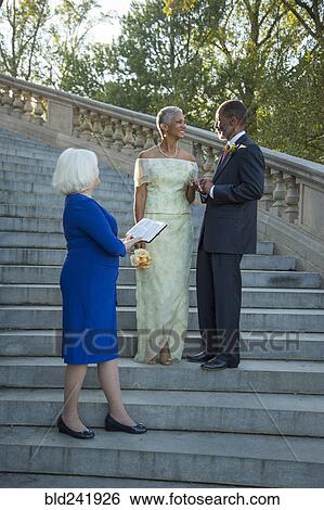 Stock Photograph - Wedding ceremony on stone staircase. Fotosearch