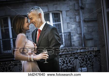 Well-dressed Caucasian couple rubbing noses View Large Photo Image Stock Image - Well-dressed Caucasian couple rubbing noses. Fotosearch