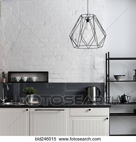 Stock Photography - White and black domestic kitchen. Fotosearch