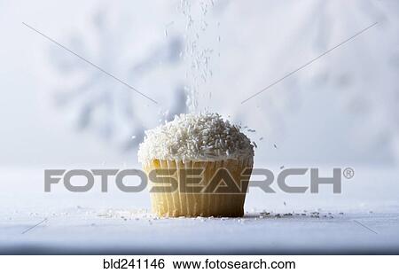 White sprinkles falling on vanilla cupcake View Large Photo Image Stock Photograph - White sprinkles falling on vanilla cupcake. Fotosearch