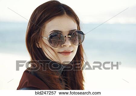 Wind blowing hair of Caucasian woman at beach View Large Photo Image Stock Photo - Wind blowing hair of Caucasian woman at beach. Fotosearch