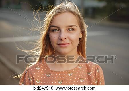 Stock Image - Wind blowing hair of Caucasian woman. Fotosearch