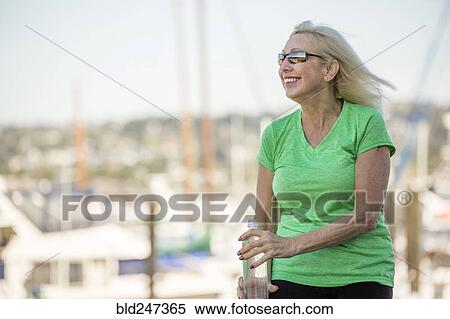 Wind blowing hair of older Caucasian woman View Large Photo Image Stock Photography - Wind blowing hair of older Caucasian woman. Fotosearch