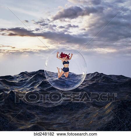 Woman floating in bubble over stormy ocean View Large Photo Image Stock Image - Woman floating in bubble over stormy ocean. Fotosearch