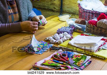 Woman sewing fabric at table View Large Photo Image Stock Photo - Woman sewing fabric at table. Fotosearch