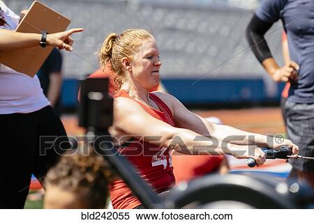 Woman using rowing machine outdoors View Large Photo Image Stock Photography - Woman using rowing machine outdoors. Fotosearch