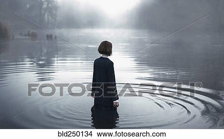 Woman wading in rippling river View Large Photo Image Picture - Woman wading in rippling river. Fotosearch
