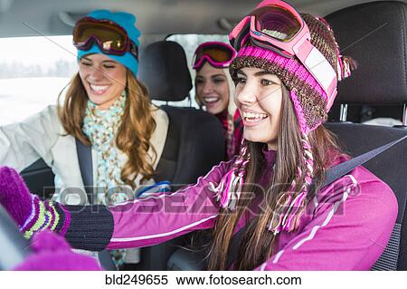 Stock Photography - Women driving in car in winter. Fotosearch